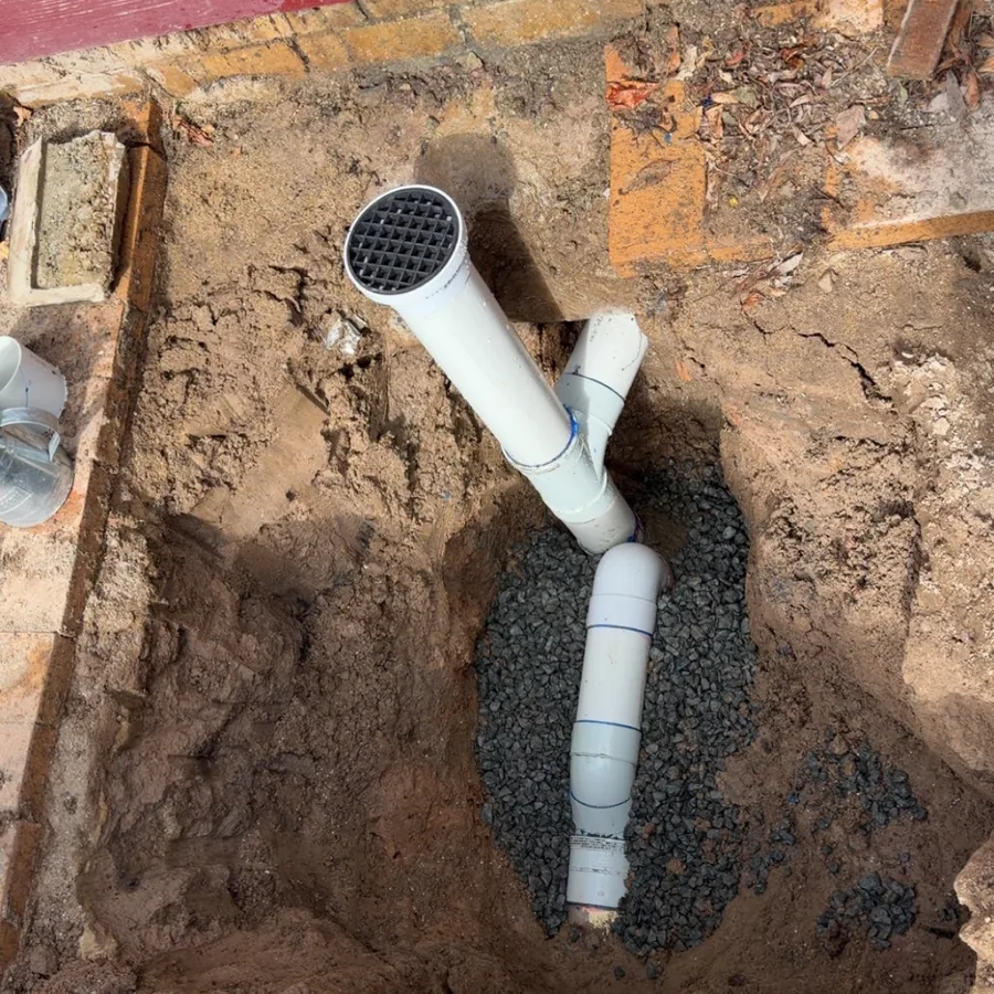 New PVC drain pipe laid in a trench