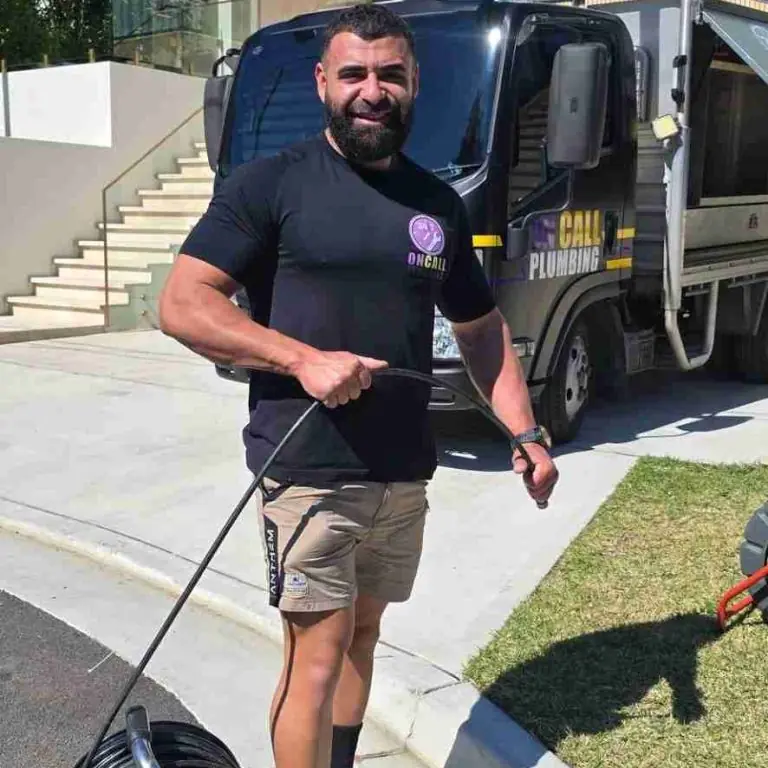 On Call Plumbing clearing a blocked drain in Canberra