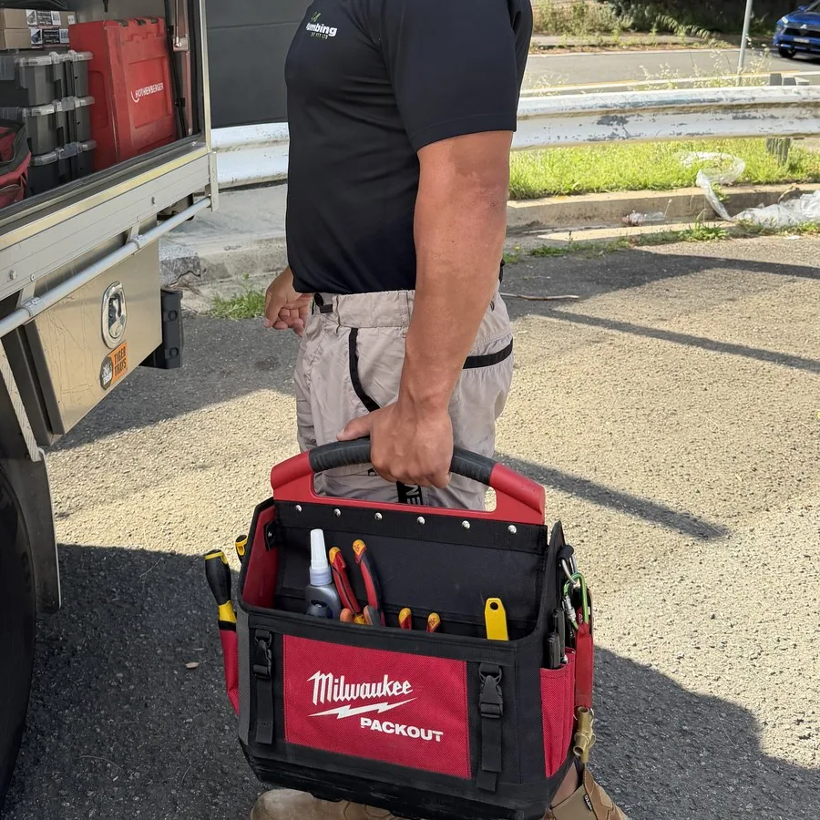 On Call Plumbing plumber with toolbag at the work ute