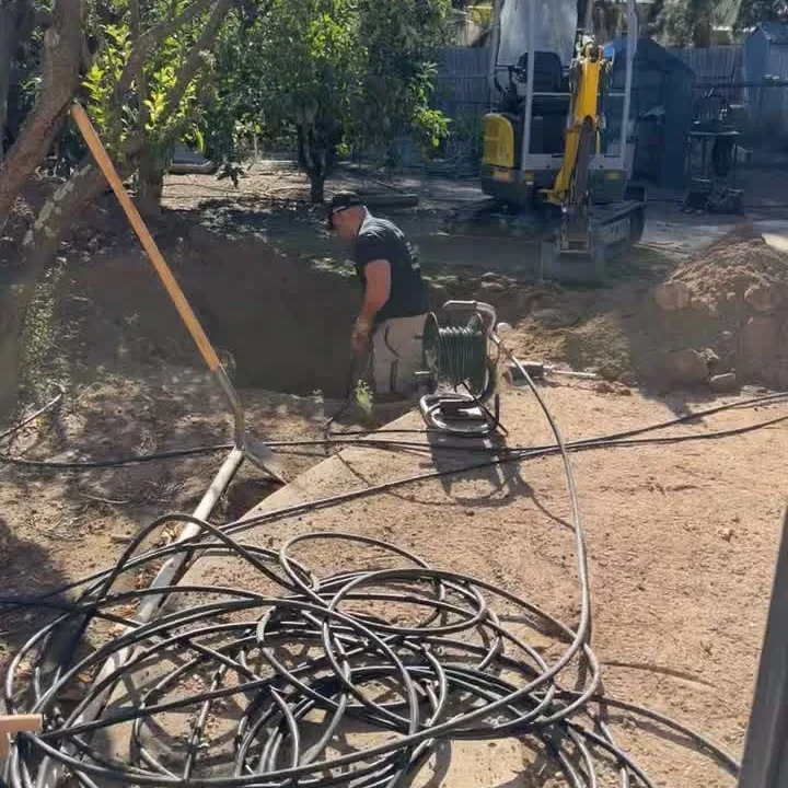 On Call Plumbing excavating to reach an underground pipe in Canberra