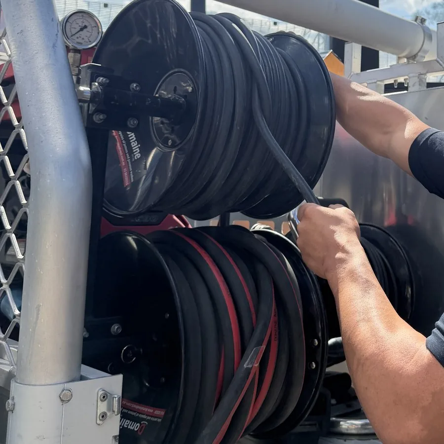 Pressure gauge and hose reels on On Call Plumbing's jetter rig